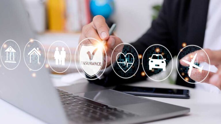 A person places proof of car insurance and a driver's license on the dashboard of a parked car.